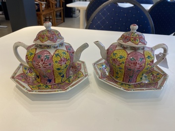 A pair of Chinese octagonal famille rose teapots on stands, Yongzheng