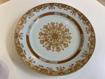 A large Chinese iron-red and gilt dish with ornamental design, Qianlong