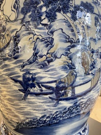 A large Chinese blue, white and copper-red vase with a mountainous river landscape, 19th C.