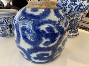 Three Chinese blue and white vases and a monochrome red vase, 19th C.