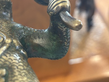 A rare bronze 'wild man' candlestick, Flanders or Germany, 15/16th C.