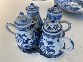 A rare Chinese blue and white set of two jugs and two casters on stand, Qianlong
