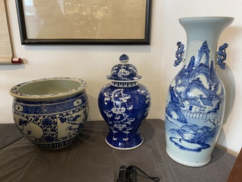 A Chinese blue and white 'landscape' vase, a covered vase and a jardini&egrave;re, 19th C.