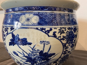 A Chinese blue and white 'landscape' vase, a covered vase and a jardini&egrave;re, 19th C.