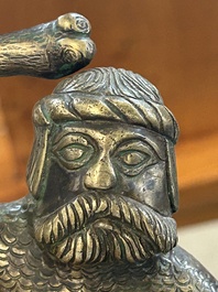 A rare bronze 'wild man' candlestick, Flanders or Germany, 15/16th C.