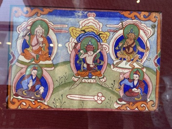 Eight tsaklis and three painted wood book covers, Tibet, 19th C.