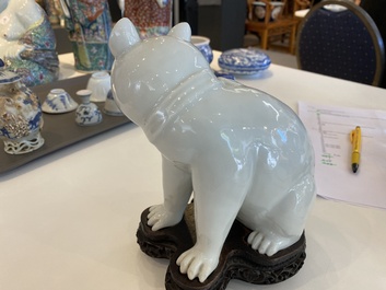 A Chinese blanc de Chine model of a cat on wooden stand, Republic