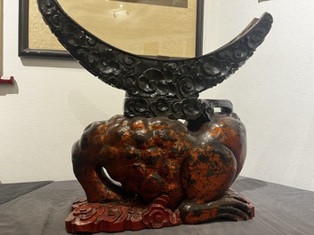 A large Chinese lacquered wooden stand in the shape of a three-legged toad, Ming