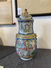 A Chinese Canton famille rose blue-ground vase and cover, 19th C.