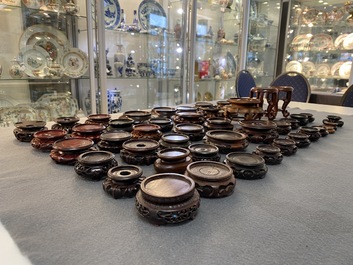 71 Chinese well-carved wooden stands, 19/20th C.