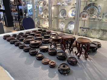 71 Chinese well-carved wooden stands, 19/20th C.