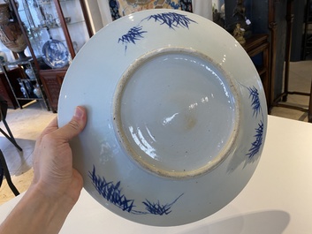 A Chinese blue and white dish and ten plates, 19th C.