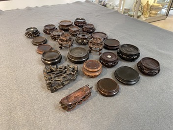 71 Chinese well-carved wooden stands, 19/20th C.