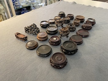 71 Chinese well-carved wooden stands, 19/20th C.