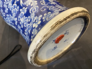 A Chinese blue and white 'Shou' vase with butterflies and a pair of sang-de-boeuf-glazed bottle vases, 19/20th C.