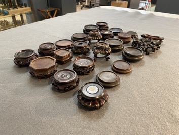 71 Chinese well-carved wooden stands, 19/20th C.