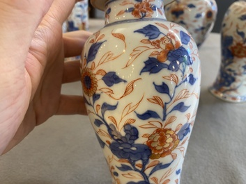 A Chinese Imari-style garniture of six vases with floral design, Kangxi