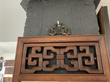 A Chinese wooden mirror and a foldable stool, 19/20th C.