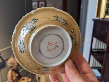 Three Chinese Kangxi-style caf&eacute;-au-lait-ground famille verte cups and saucers, rabbit mark, 19th C.