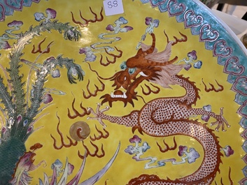 A Chinese yellow-ground famille rose 'dragon and phoenix' dish, Qianlong mark, 19/20th C.