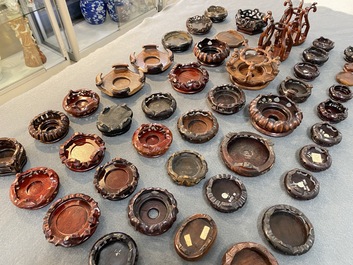 71 Chinese well-carved wooden stands, 19/20th C.