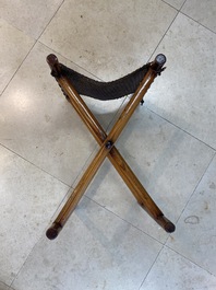 A Chinese wooden mirror and a foldable stool, 19/20th C.