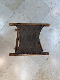 A Chinese wooden mirror and a foldable stool, 19/20th C.