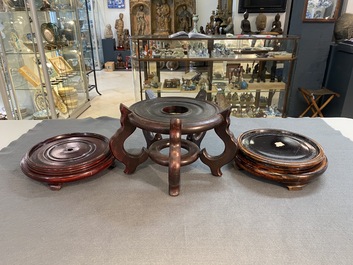 A varied collection of Chinese wooden stands, 19/20th C.