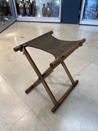 A Chinese wooden mirror and a foldable stool, 19/20th C.