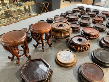 71 Chinese well-carved wooden stands, 19/20th C.
