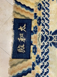 A large Chinese Ningxia rug with dragons on a yellow ground, Tai He Tian 太和殿 mark, 19th C.