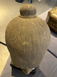 A Khmer stone head of Jayavarman VII in Bayon-style, Cambodia, probably 13th C.