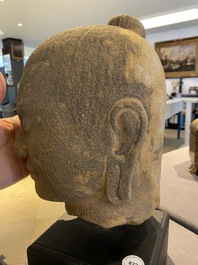 A Khmer stone head of Jayavarman VII in Bayon-style, Cambodia, probably 13th C.