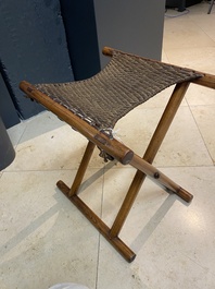 A Chinese wooden mirror and a foldable stool, 19/20th C.