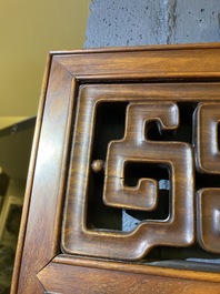 A Chinese wooden mirror and a foldable stool, 19/20th C.