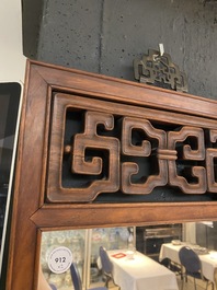 A Chinese wooden mirror and a foldable stool, 19/20th C.