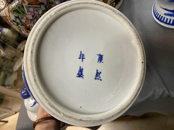 A pair of Chinese blue and white covered vases and a pair of Nanking famille rose vases, 19th C.