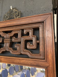 A Chinese wooden mirror and a foldable stool, 19/20th C.