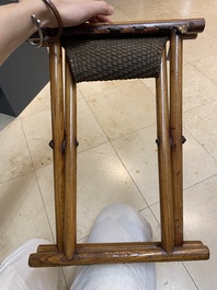 A Chinese wooden mirror and a foldable stool, 19/20th C.