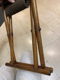 A Chinese wooden mirror and a foldable stool, 19/20th C.