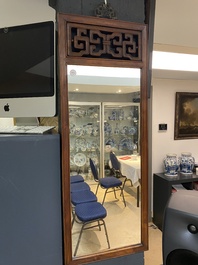 A Chinese wooden mirror and a foldable stool, 19/20th C.