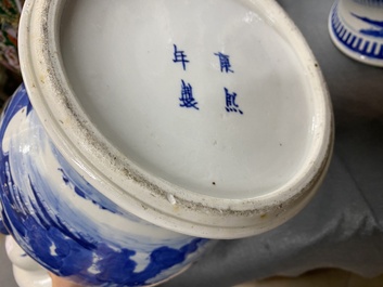 A pair of Chinese blue and white covered vases and a pair of Nanking famille rose vases, 19th C.