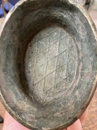 A Chinese archaic bronze ritual 'you' wine vessel and cover in Western Zhou-style, Ming