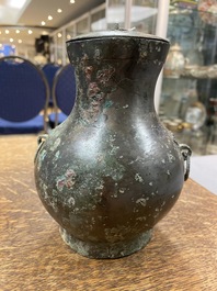 A Chinese bronze 'hu' vase and cover, Han