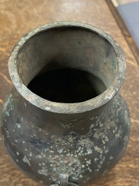 A Chinese bronze 'hu' vase and cover, Han