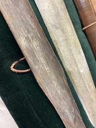 A Chinese bronze dagger with wooden scabbard in a display case, Han