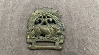 A Roman bronze model of a panther and a belt plate with a lion, ca. 2nd C.