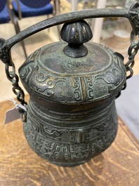 A Chinese archaic bronze ritual 'you' wine vessel and cover in Western Zhou-style, Ming