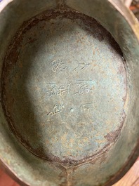 A Chinese archaic bronze ritual 'you' wine vessel and cover in Western Zhou-style, Ming