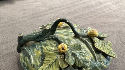A polychrome Dutch Delft melon-shaped tureen on leaf-shaped stand, 18th C.